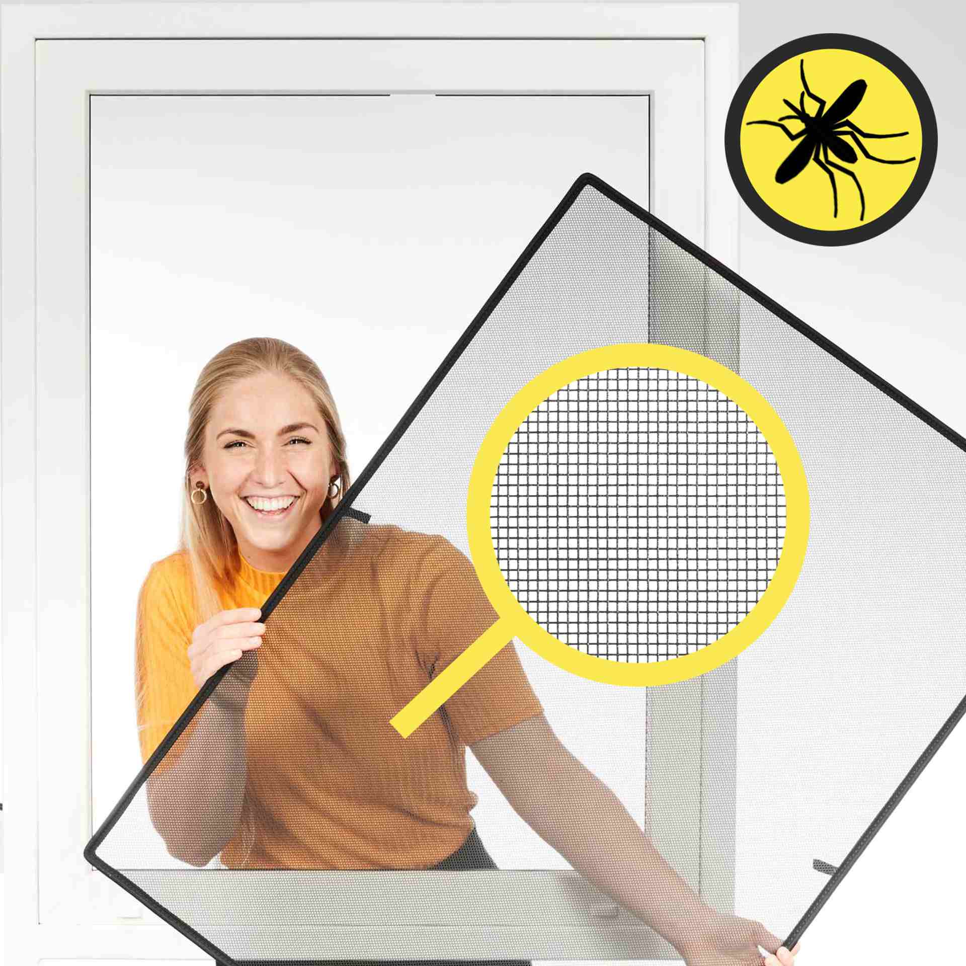 a woman smilingly holds the WinClip through a window